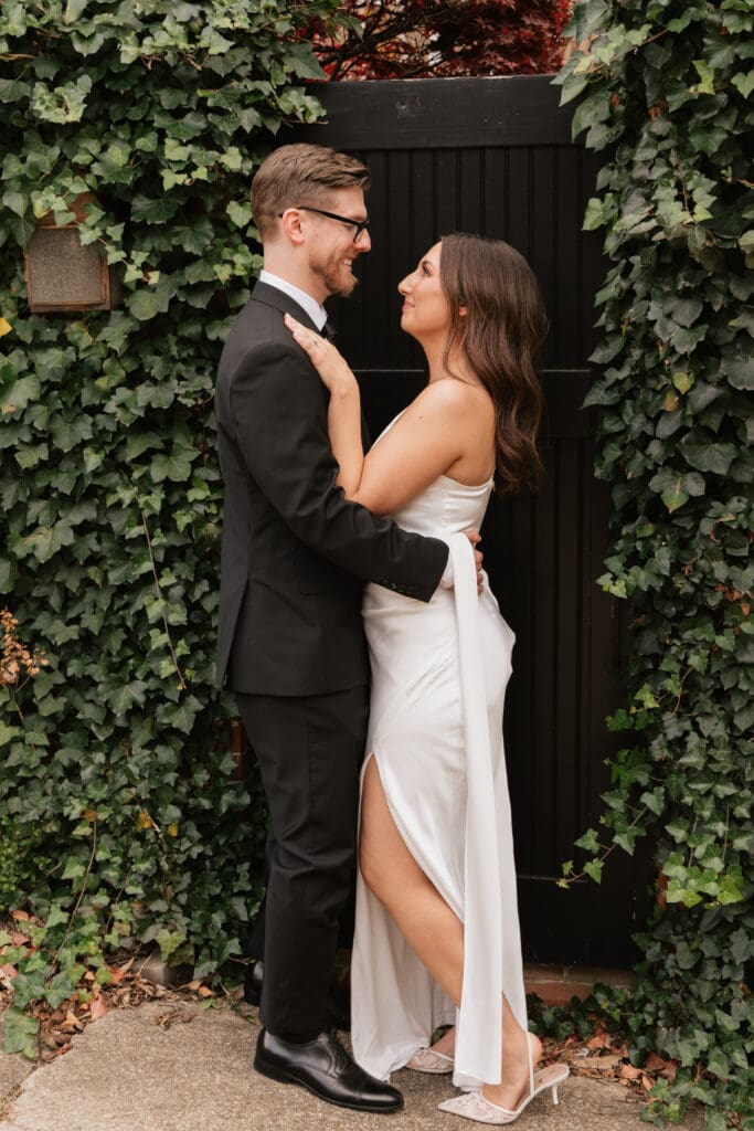 Couple sharing a tender moment in the historic Wales Alley in Old Town 
Alexandria, Virginia during their intimate November elopement — Kelly Wineinger Creative