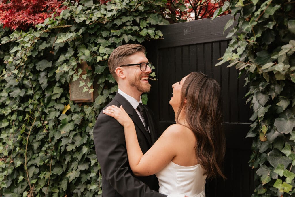 Couple sharing a tender moment on the historic cobblestone streets of Captain's Row in Old Town 
Alexandria, Virginia during their intimate November elopement — Kelly Wineinger Creative