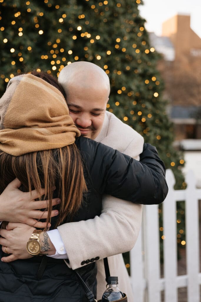 Groom hugs a family member after a small Northern VA wedding ceremony