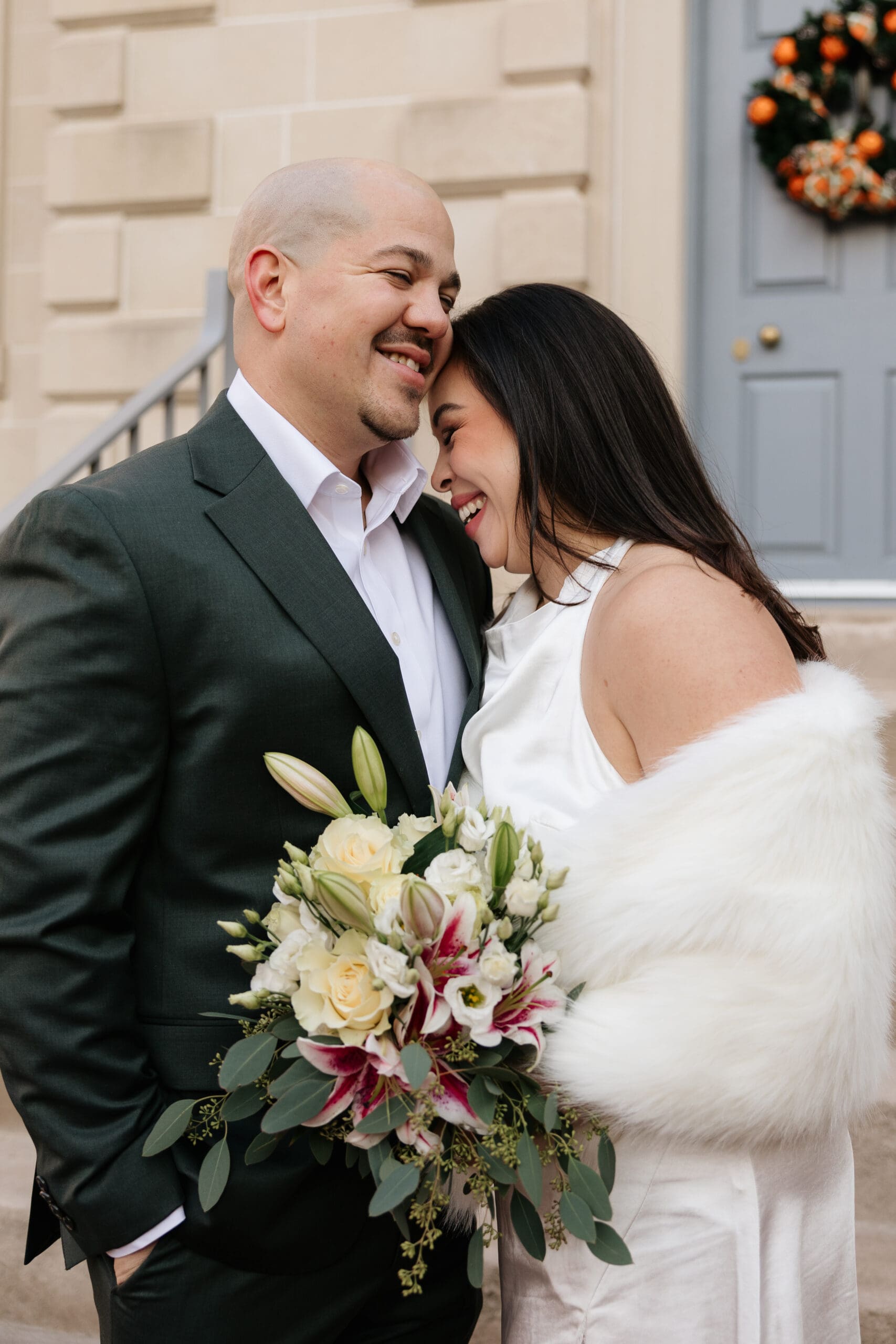 A couple shares an intimate moment during their bridal portraits at Carlyle House after an intimate elopement in Old Town Alexandria, Virginia.