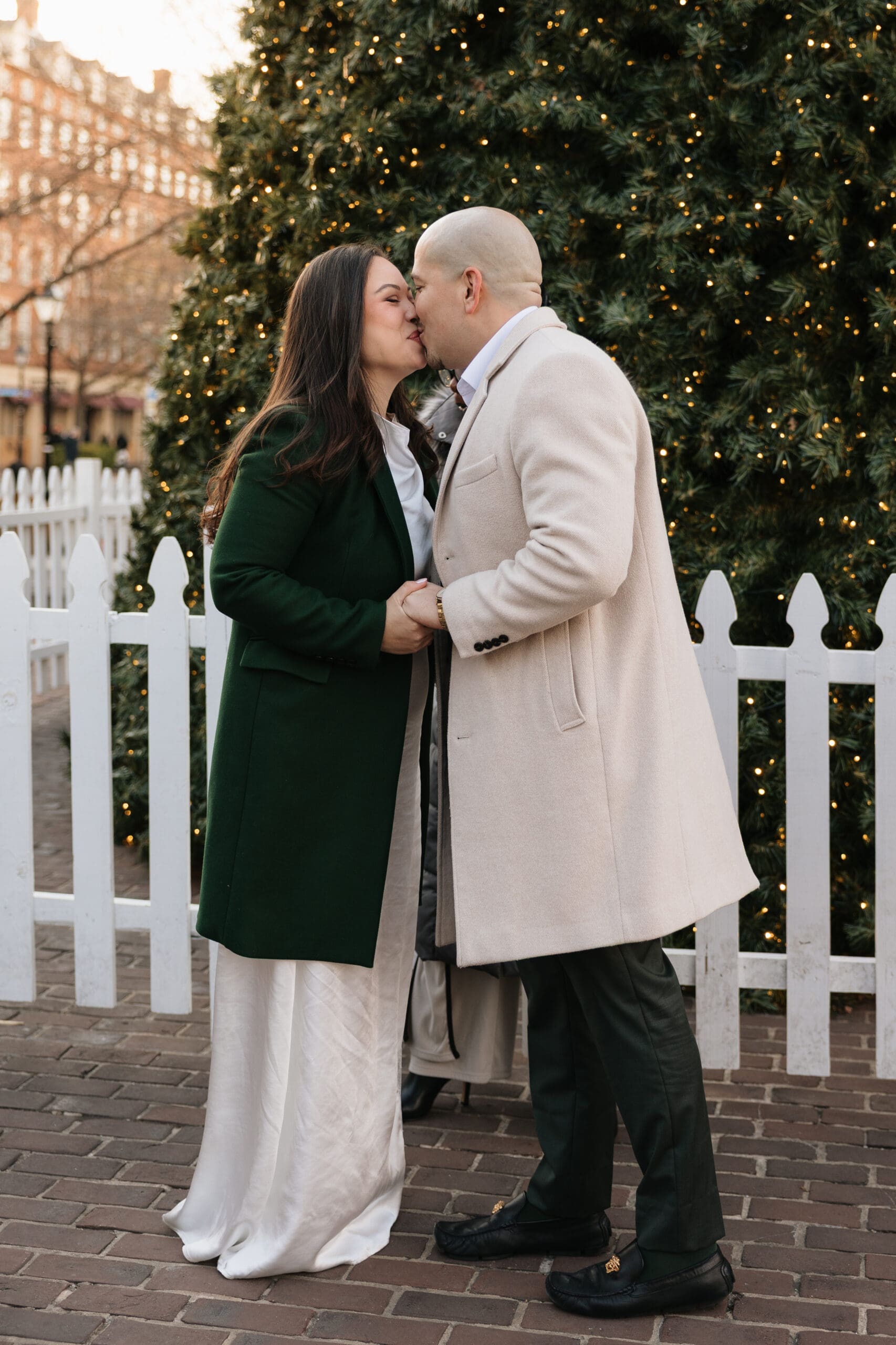 A couple shares their first kiss as a married couple during their romantic elopement ceremony in Old Town Alexandria, VA.