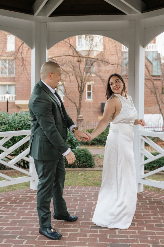 newlywed couple shares a first dance in the gardens at the historic Carlyle House