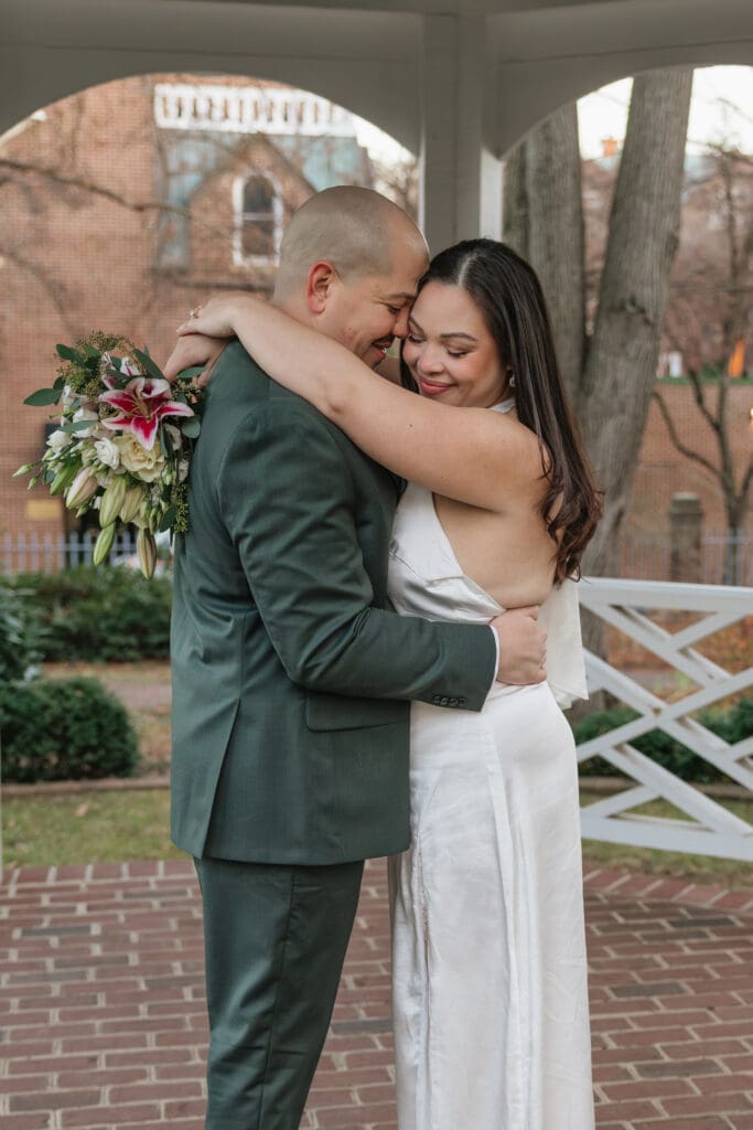 newlywed couple shares a first dance under the gazebo at historic Carlyle House