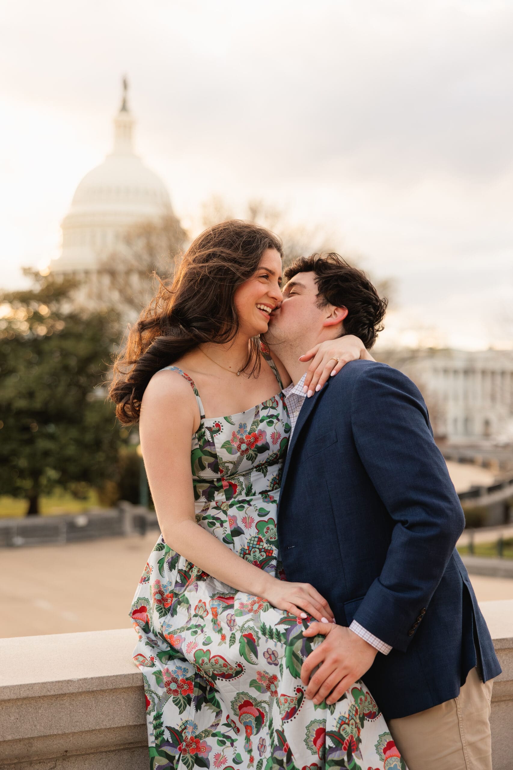 candid photo of an Arlington couple laughing together during their engagement photoshoot in Washington DC