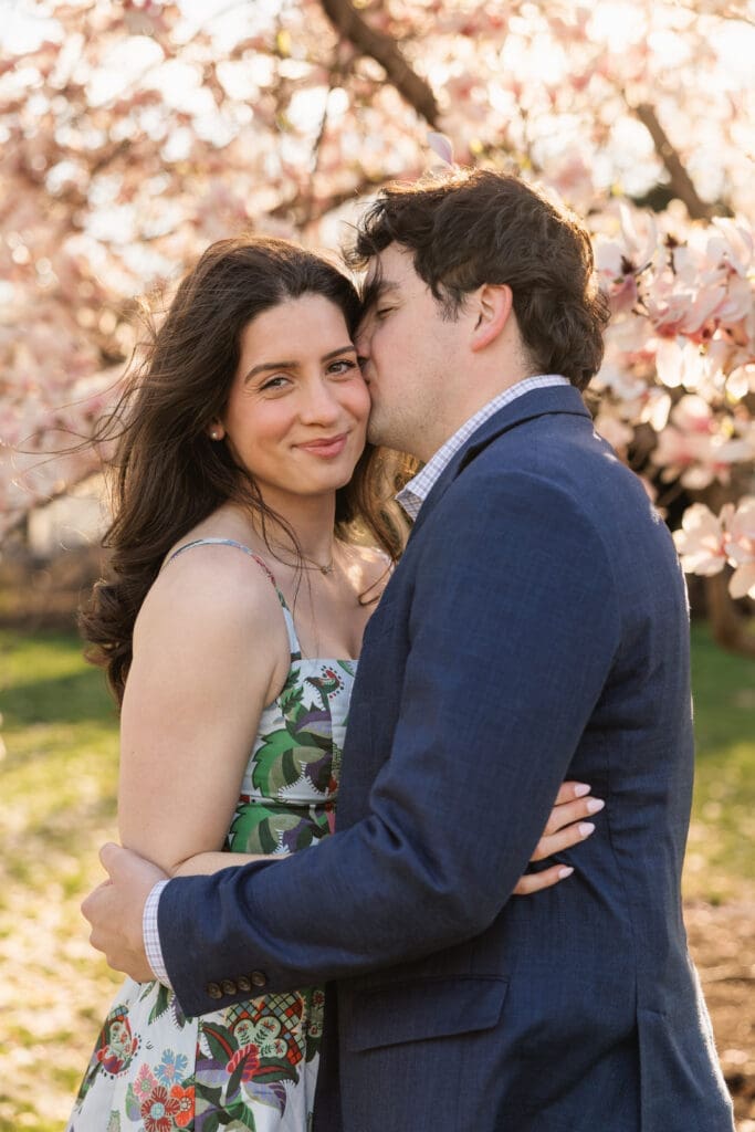 Couple shares an intimate moment during DC engagement photos during cherry blossom season