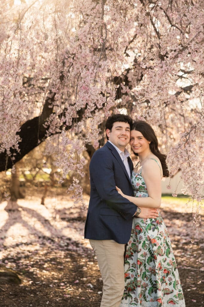 Arlington-based couple poses for a photo during a spring engagement photoshoot in nearby Washington DC