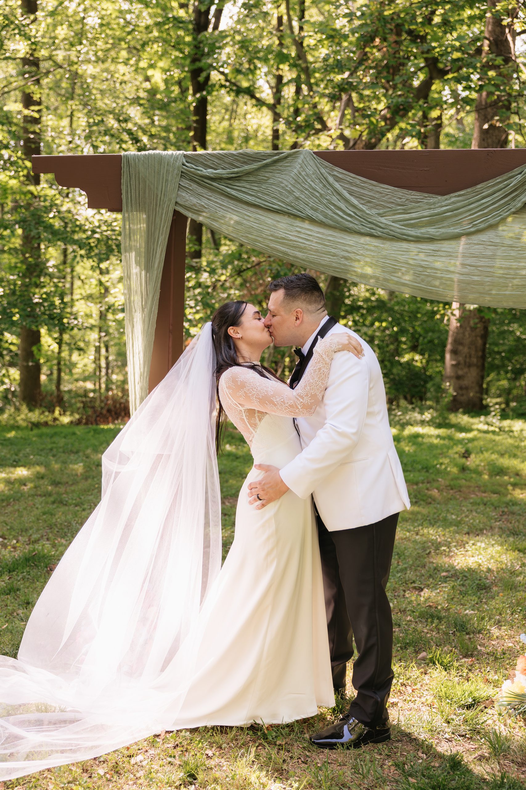couple shares first kiss in intimate northern virginia backyard wedding
