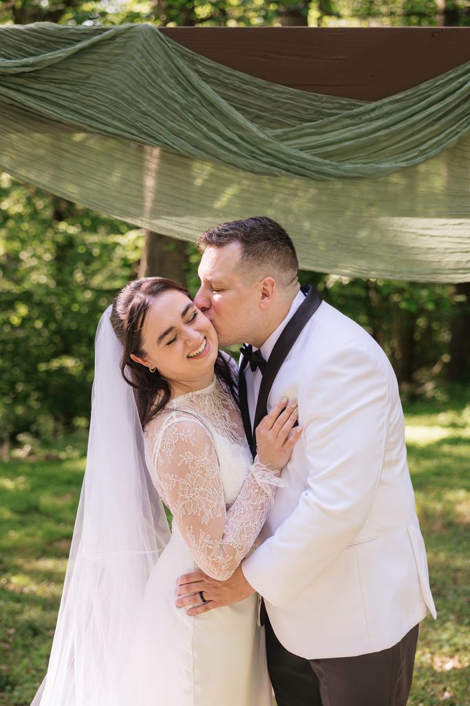 couple smiles for a candid wedding portraits after Northern VA ceremony