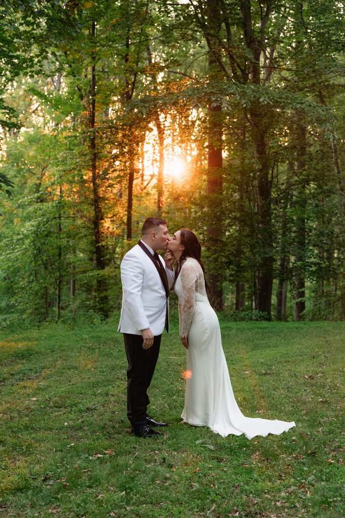 couple kisses during sunset photos after their Northern VA wedding