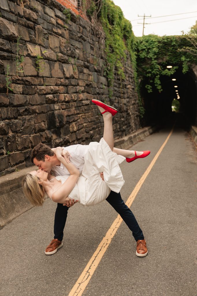 couple shares an intimate moment during an engagement photo shoot in Old Town Alexandria, a classic Northern VA engagement photo location