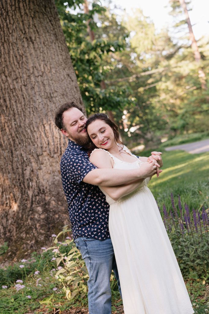 couple hugs during engagement photo session in the DMV